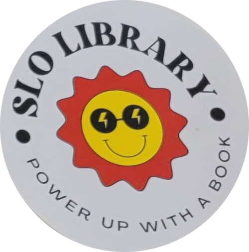 A white badge with black writing that reads SLO LIBRARY: POWER UP WITH A BOOK with a smiling cartoon sun with sunglasses with lighting bolts in the lenses